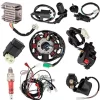 An assortment of electrical parts for 125cc ATV