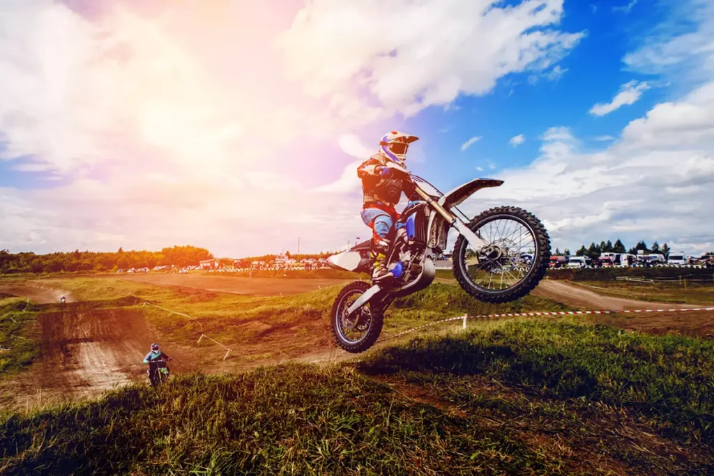 Dirt bike rider doing a wheely