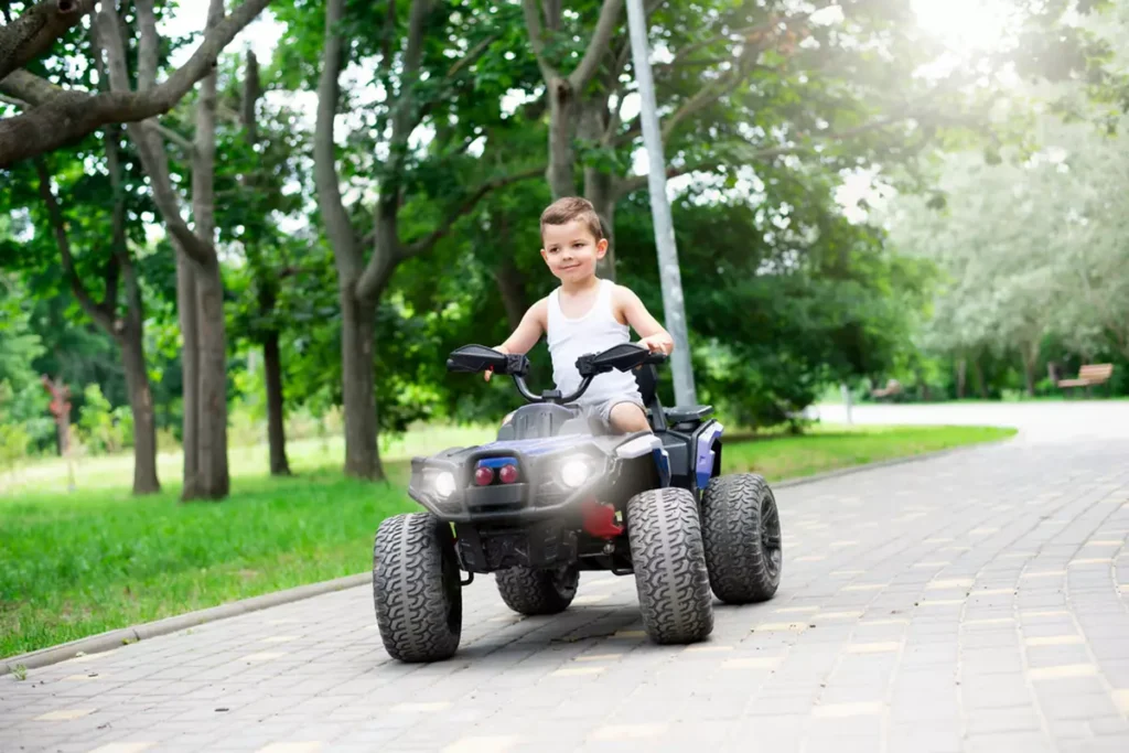 Cute child riding an ATV