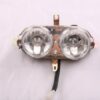 A pair of Head Light F5 (HL-13) (DQL-GN002) illuminating a white surface.