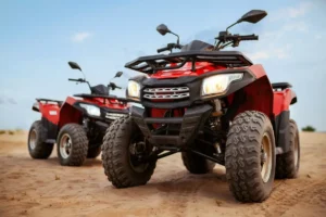 Two red ATVs