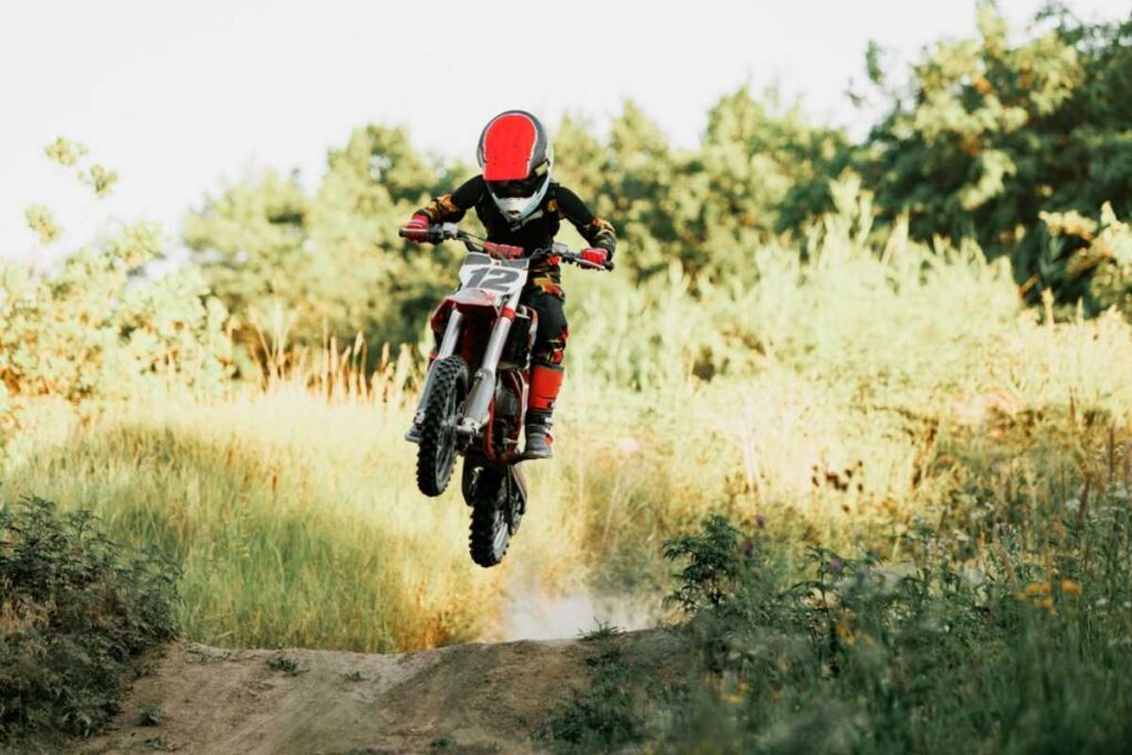 Young child riding a dirt bike