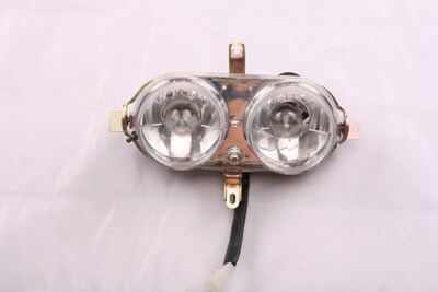 A pair of Head Light F5 (HL-13) (DQL-GN002) illuminating a white surface.