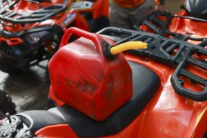 Gas can sitting on an ATV seat